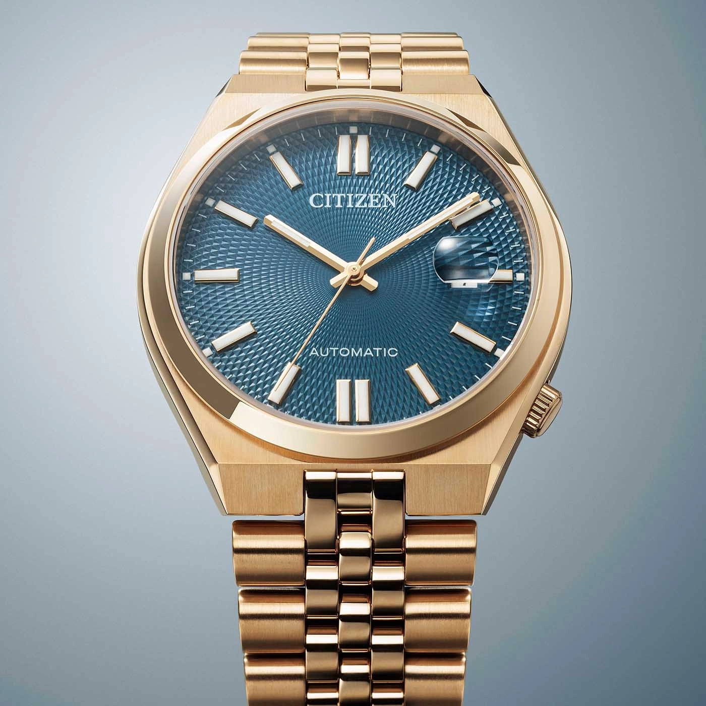 Goldene Citizen-Uhr mit blauem Zifferblatt und Automatikwerk, elegantes Design.