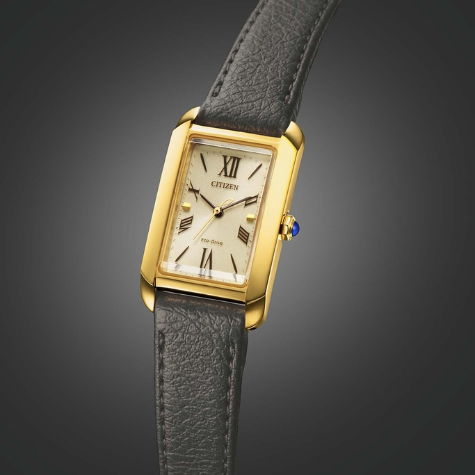 Goldene Citizen-Uhr mit rechteckigem Zifferblatt und Lederarmband.