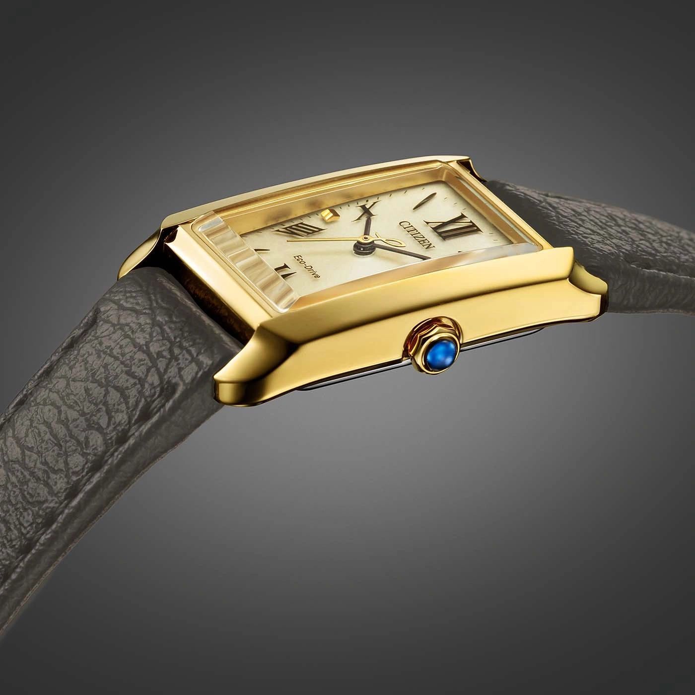 Goldene Citizen-Uhr mit rechteckigem Zifferblatt und Lederarmband.